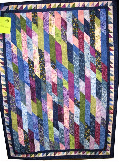 (Left image shows me stopping 1/4" from the end; right images shows me stitching diagonally down to the corner. . Diagonal jelly roll quilt